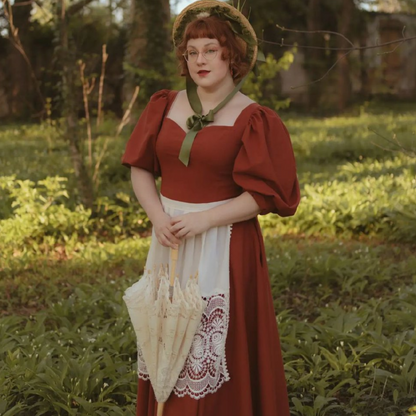 Rust Rosie Cotton corset style linen dress. Handmade Shire rust corset style linen dress with princesscore V waist and puff sleeves.