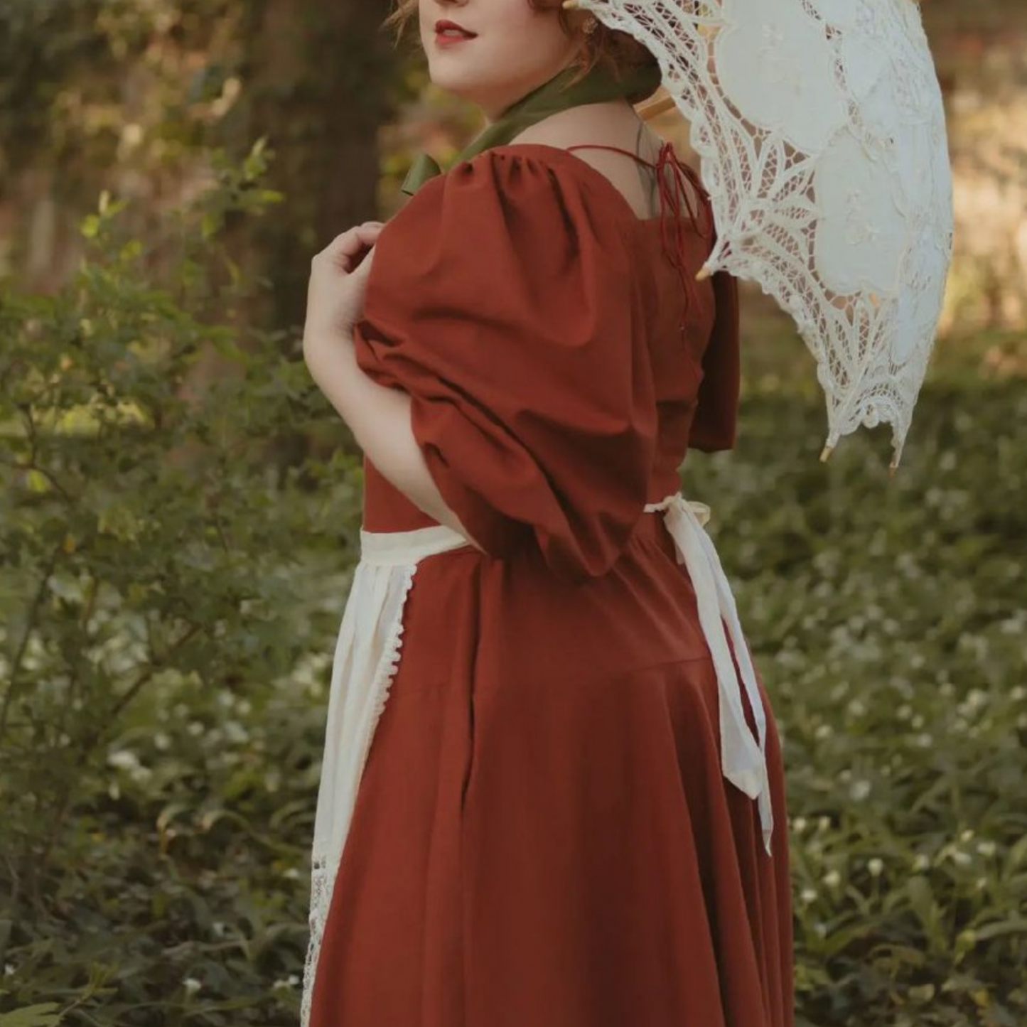 Rust Rosie Cotton corset style linen dress. Handmade Shire rust corset style linen dress with princesscore V waist and puff sleeves.