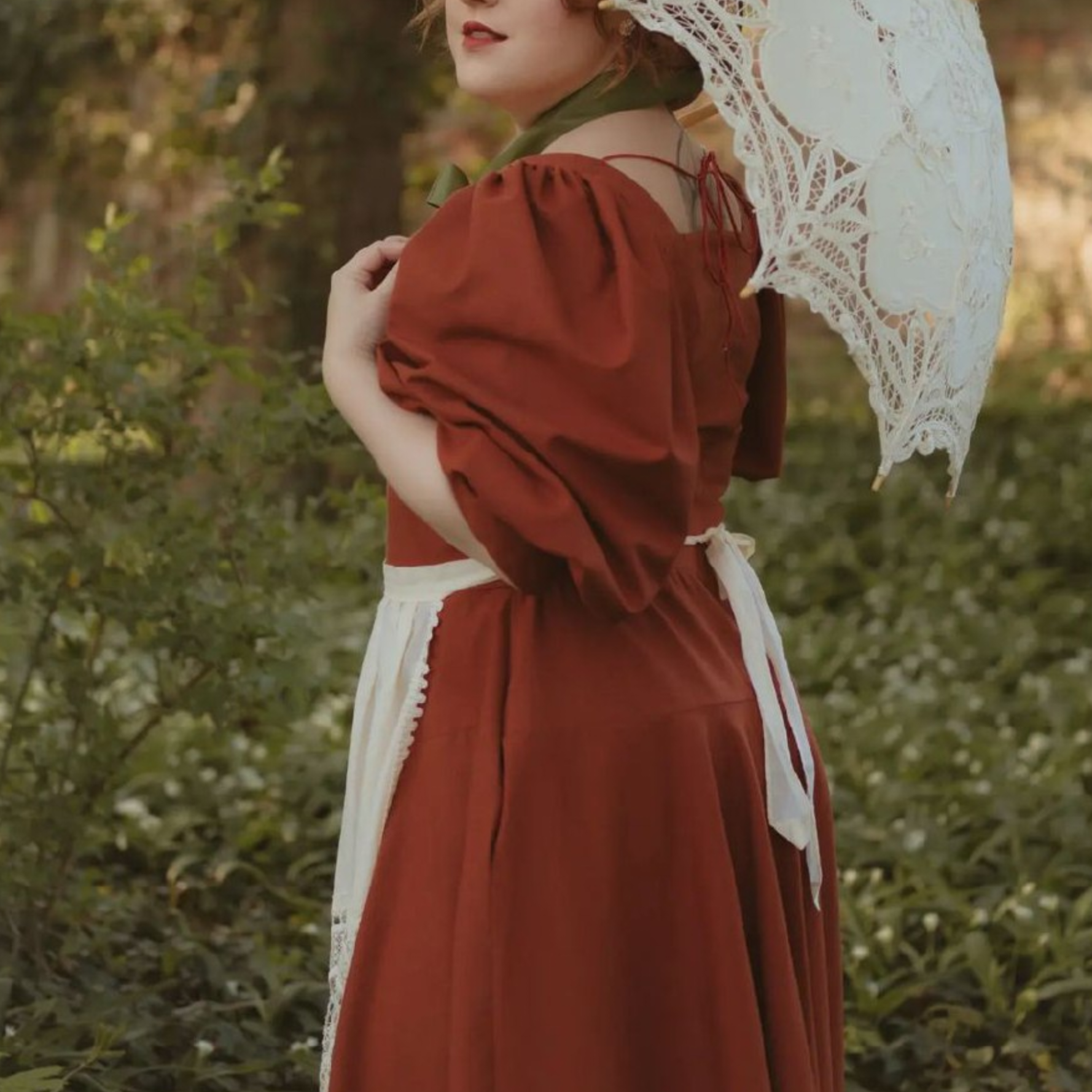 Rust Rosie Cotton corset style linen dress. Handmade Shire rust corset style linen dress with princesscore V waist and puff sleeves.