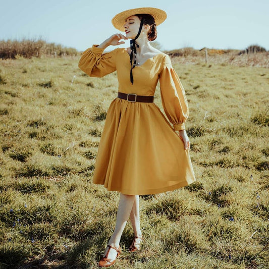 Handmade vintage style mustard linen dress with V neckline, twirl skirt and puff sleeves.