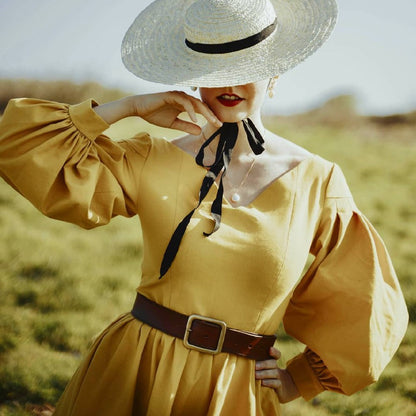 Handmade vintage style mustard linen dress with V neckline, twirl skirt and puff sleeves.