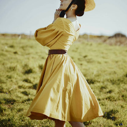 Handmade vintage style mustard linen dress with V neckline, twirl skirt and puff sleeves.